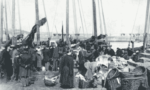 Image shows fishing boats in Newhaven harbour in the late 19th century. National Records of Scotland reference GD265/16/16/2